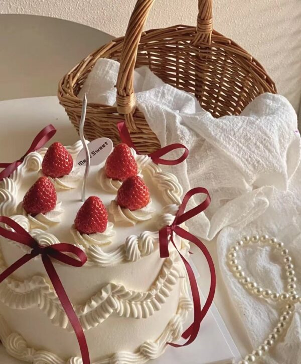 retro ribbon strawberry frosted cake