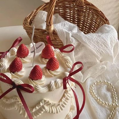 retro ribbon strawberry frosted cake